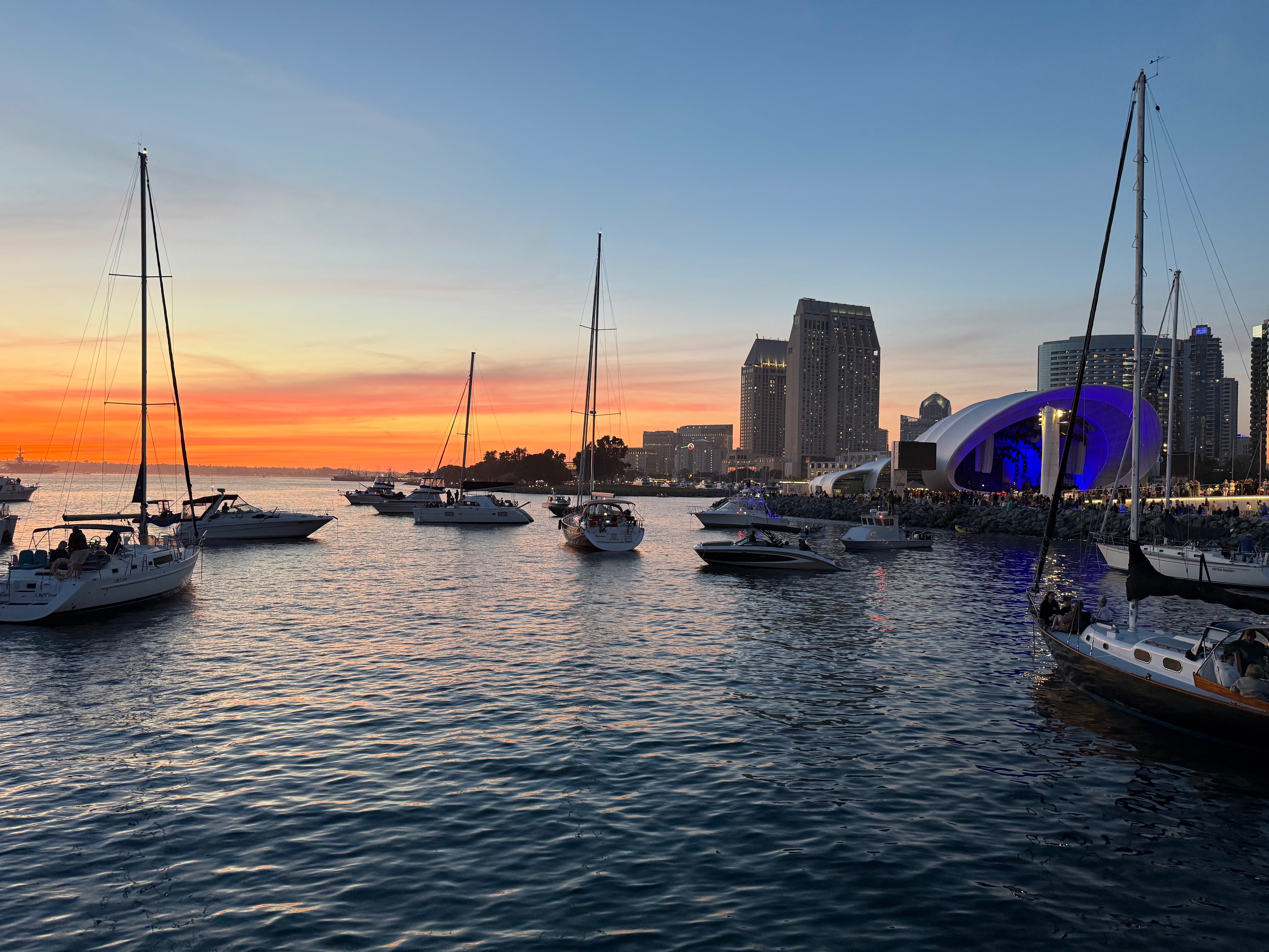 Sunset at San Diego Bay with boats near the Symphony Shell